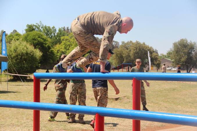 Competitor tackling obstacle bars at Potchefstroom, AI generated