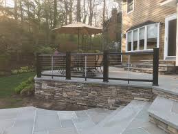 A Beautiful Composite Post And Cable Rail Fence On Blue Stone Patio Deck In Smithtown Patio Stones Bluestone Patio Patio Railing