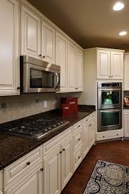 Welcome to our gallery featuring bianco antico granite countertops with white cabinets: Contemporary Kitchen White Kitchen Cabinets Baltic Brown Granite Countertop Brown Granite Countertops Brown Granite White Granite Countertops