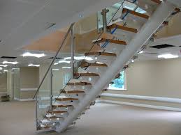 A Steel Floating Staircase With Stainless Steel Handrails And Pan Treads Filled With Concrete All Fabricated Staircase Stainless Steel Handrail Modern Stairs