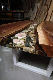 The beauty of lacquer is that it can be used to create so many different looks. Live Edge Walnut Coffee Table With Rock Filled River Anglewood Live Edge Custom Furniture Toronto Wood Table Design Wood Resin Table Resin Tables