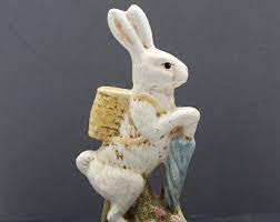 Bunny Rabbit With Blue Umbrella And Wicker Basket On His Back Plastic Clay Material Figurine Statue Blue Umbrella Unique Items Products Wicker Baskets