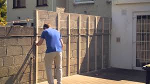 Also, try mixing 1 cup (240 ml) of a mild dish soap into about 5 us gal (19,000 ml) of hot water to scrub off tough stains with a concrete brush. Cement Block Wall Covering Novocom Top