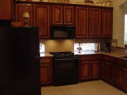 Dark brown kitchen cabinets with black appliances. Free Download Go Back Gallery For Black Kitchen Appliances Vs Stainless Steel 640x480 For Your Desktop Mobile Tablet Explore 45 Stainless Steel Wallpaper For Appliances Stainless Steel Wallpaper Brushed