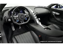Instead of small parts and pompous waste of space, the interior is dominated by defined minimalism. Black And Blue Bugatti Chiron Would Be A Standout In Any Exotic Collection Carscoops