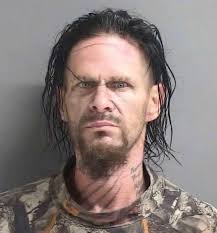Game Wardens with Texas Parks and Wildlife arrested Ethan McNeely, a 39  year old Oregon transplant, yesterday after discovering him crouched in the  woods below the dam at Lake Tawakoni attempting to