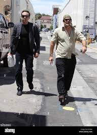 Nicolas Cage out and about in Beverly Hills with his film director brother, Christopher  Coppola Featuring: Nicolas Cage, Christopher Coppola Where: Los Angeles,  California, United States When: 05 Aug 2015 Stock Photo
