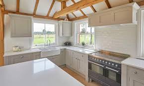 To add a traditional kitchen look the customer added a kitchen mantle and a slimline shaker door. French Grey Shaker Kitchen Chidingfold Kitchens