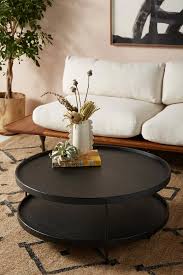 It's topped with a durable quartz composite, a material prized for its color consistency. Anthropologie Noir Tiered Coffee Table
