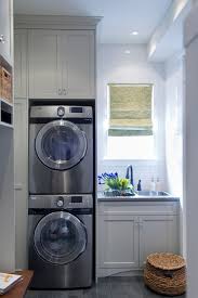 Stacked washer and dryer set in the bathroom off the kitchen. Mud Room Office Combo Design Ideas