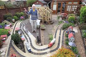 The members all have model trains set up in their back yards. Garden Model Trains Cheap Toys Kids Toys