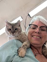 Hi all! This is me and our shop cat pouring candles. Her name is Gandalf.  We took her in as a stray & she quickly became head cheerleader, quality  control manager, therapist,