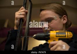 NEWPORT NEWS, Va. (May 11, 2016) Hull technician Fireman Haley Brogan,  assigned to Pre-Commissioning Unit Gerald R. Ford (CVN 78), drills holes  into a TV mount. Ford is currently under construction at