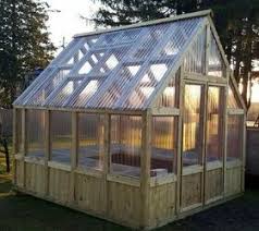 Obsessed with this diy greenhouse made from old windows! How To Build A Diy Greenhouse On A Budget Hometalk