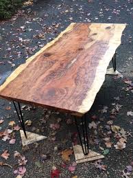 The differences that set a live edge slab apart from other wood slabs lie in the aesthetics of the slab top, the visual appearance of the grain, and the edge of the slab. Hand Crafted Redwood Slab Dining Table With Live Edges By Fredric Blum Design Custommade Com
