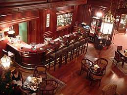 Find an excuse to reach out to something from across her. Bar Wikipedia