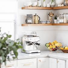 I've found that having a bowl or two of fruit on the shelves is also an easy way to free up some counter space and make the kitchen feel less cluttered. Ikea Small Space Design Tricks Stylists Swear By