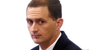 Ex-Mt. Olive cop pardoned by former Gov. Christie wants his job back