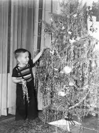 .the christmas tree are glass bulbs in numerous colours and shapes, peppermint candy canes, wreaths, bells, fluffy white angel's hair, or shiny mistletoe is another christmas symbol. Tinsel The Golden Glow Of Christmas Past
