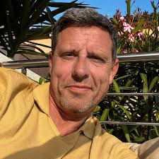 What is the building with baroque stucco work in the photo?