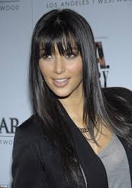 I brought the platinum back!' Kim Kardashian admits new hair is a wig