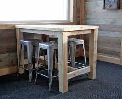 Then, use a table saw to cut 1/4″ off each side of the 2 x 8 pieces. Counter Height Farmhouse Table For Four Ana White