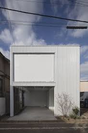 arbol design connects two family houses in tokyo with bauhaus inspired garage architecture house tokyo house