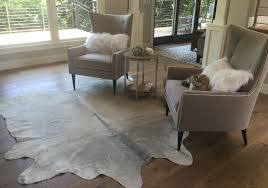 Layer a faux cowhide rug over a classic woven sisal, for instance, and a traditional space feels infinitely chicer. Love The Clean And Modern Look Using A Cowhide Rug Grey Cowhide Rug Grey Cow Hide Cowhide Rug Living Room