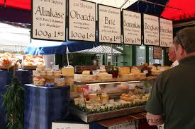 A Cheese Vendor In The Viktaulienmarkt In Munich Germany Germany Make It Yourself Places Around The World