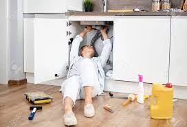 Homeadvisor's sink installation cost guide provides the price to replace or install a new sink. Woman Fixing Kitchen Sink Housewife Working Under Kitchen Sink Stock Photo Picture And Royalty Free Image Image 131728310