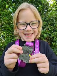 Turned 5 in March, climbed Meelmore in June. His wee medal arrived this  morning and he couldnt be more chuffed!! Thanks Mourne Mountain Adventures  for sending it so quickly xx