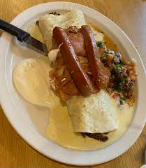 Local Mexican restaurants special. Burrito topped with ham and hotdogs.  Stuffed with steak and more hotdogs. : rshittyfoodporn