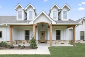 Modern farmhouse is, by far, the most popular home style of our time and the search for the perfect floor plan is in huge demand. Light Grey With Wood Accents Grey Exterior House Colors Gray House Exterior Modern Farmhouse Exterior