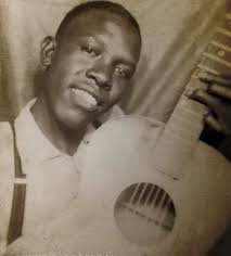 ROBERT JOHNSON (1911-1938) was a gifted Mississippi Delta blues singer,  songwriter and guitarist, that recorded 29 songs in two recording sessions,  in 1936 and '37. He died at age 27, after being