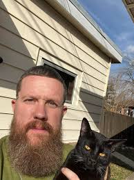 OWNERS FOUND! Black male cat hanging around vista Hills neighborhood. He  was very wary of me at first, but seemed very hungry, so I fed him some  meat I had in the