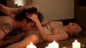 Couple having erotic fuck surrounded by candles