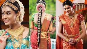 South indian bridal hairstyle with hair jewellery and also decorated with a different flowers. South Indian Wedding Hairstyles For Long Hair Wedding Galery