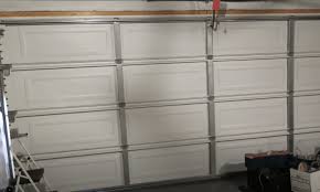 Save money by doing it yourself! 2 Cheap Ways To Insulate A Garage Door