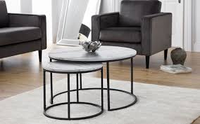 The nesting tables feature a lean metal frame that combines smooth curves and crisp lines, while a textured aluminum top adds visual interest. Bellini Round Nesting Coffee Table White Marble