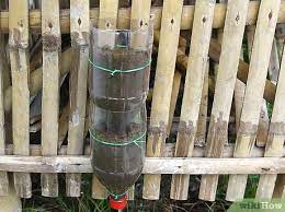 Urban vertical garden built from hundreds of recycled soda bottles. How To Build A Vertical Garden From Soda Bottles With Pictures