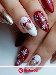 Sharper than ovals but less dangerous than stilettos. Cute Red White Snowflake Nails 2020 Almond Shaped With Two Accent Christmas Balls And Gold Glitter Nails Design In 2020 Christmas Nails Xmas Nai Clara Beauty My