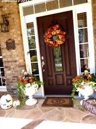 This home's front porch has plenty of seating with flowers and accessories to make this gathering spot a gorgeous and inviting space. 85 Pretty Autumn Porch Decor Ideas Digsdigs