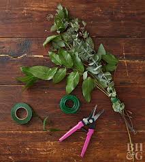 The supplies are lightweight fresh greenery, twine, scissors, a hot glue gun & glue sticks, wall hooks. Greenery Garland How To Better Homes Gardens