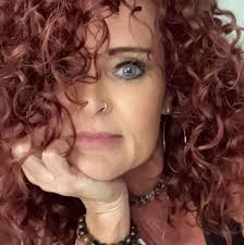 Who can cut very thick, long natural red hair?