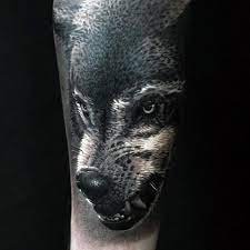 50 Realistic Wolf Tattoo Designs For Men Canine Ink Ideas Wolf Tattoos Wolf Tattoo Wolf Tattoo Shoulder