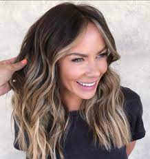 Multicolored highlights on brown hair. The Most Flattering Medium Length Brown Hairstyles To Try In 2020 Southern Living