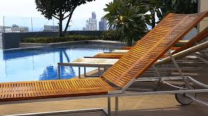 However, now you can get a wooden pool lounge chair for your poolside that is not as vulnerable to weather as typical wooden. Wooden Teak Lounge Chairs Patio Stock Footage Video 100 Royalty Free 28876915 Shutterstock