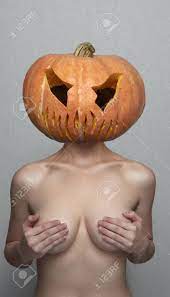 Sexy Woman With Halloween Pumpkin Head Covers Her Breasts Stock Photo,  Picture and Royalty Free Image. Image 65232136.