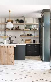 Black cabinets and subway tiles. Dark Green Kitchen Cabinets And Hand Laid Black And White Tile Flooring It S A Diy With A Tutori Green Kitchen Cabinets Kitchen Floor Tile White Kitchen Floor
