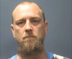 Dylan Coomer, Brandon Poehmel, Howard Burroughs and a fourth person whose  name was redacted from court documents are facing charges of murder,  manslaughter, kidnapping, assault and conspiracy.